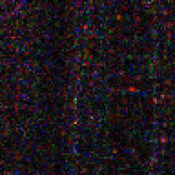 Magnified detail of the difference between the two captures: dense multicolored noise.